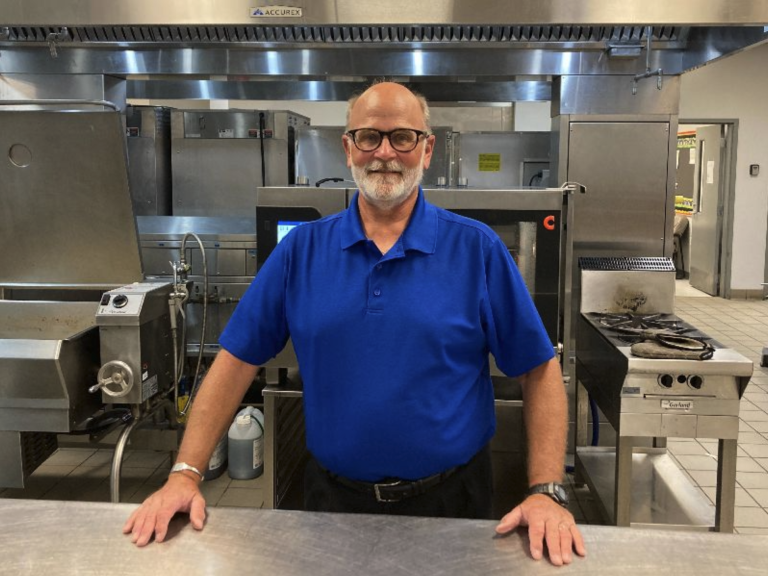 Tom-Beckmann Tom Beckmann standing in a kitchen